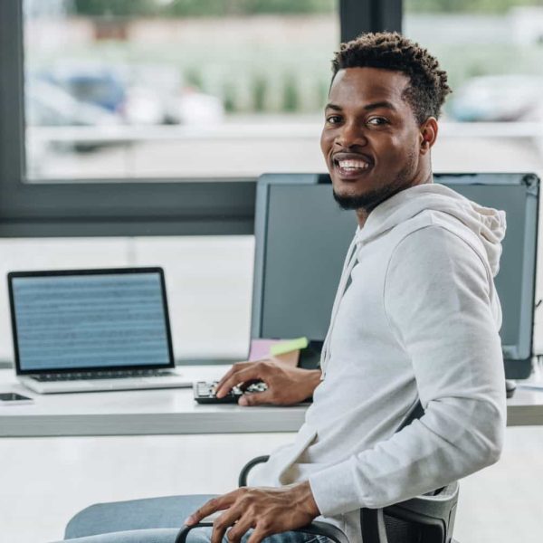 cheerful-african-american-programmer-smiling-at-ca-2021-04-06-11-05-24-utc-min.jpg